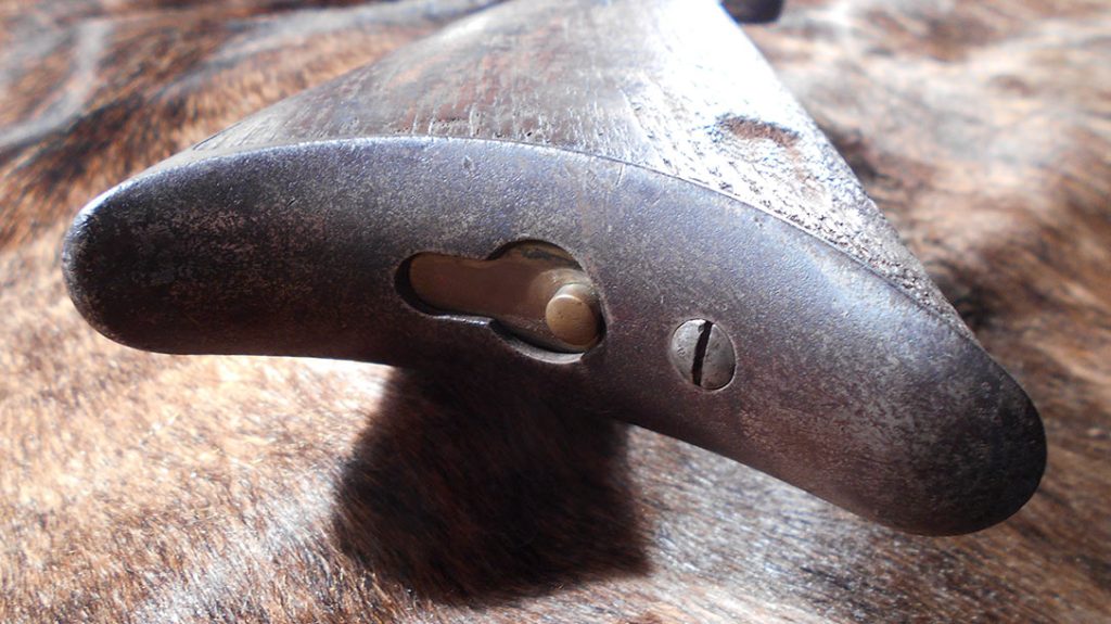 Storage compartment in the butt of the 1876 Winchester.