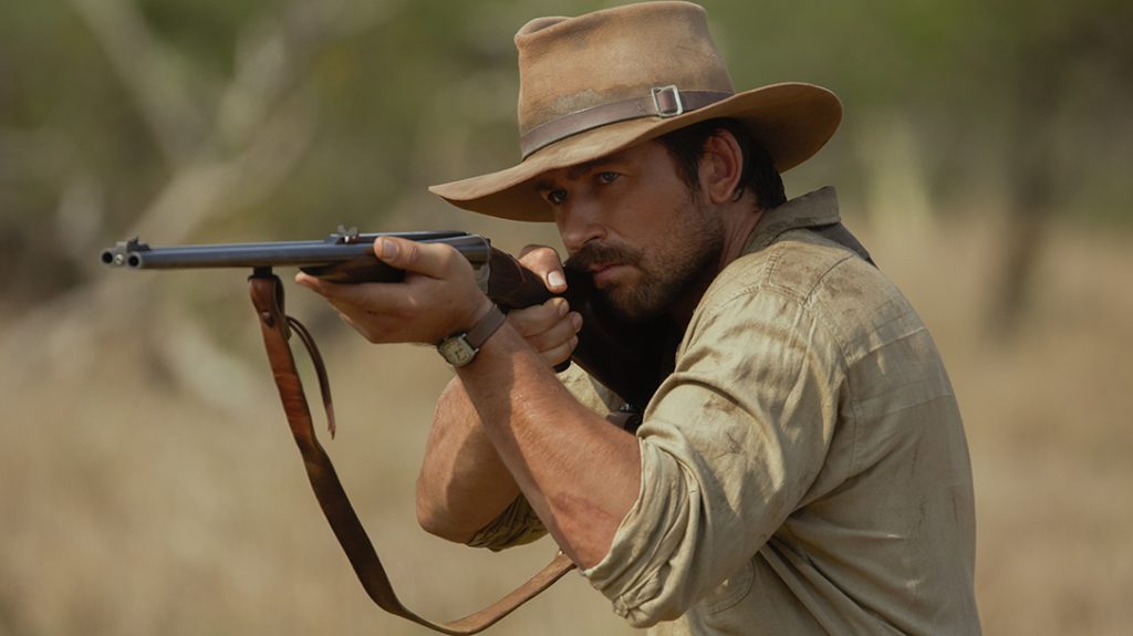 Brandon Sklenar as Spencer Dutton with the double barrel rifle &ndash; likely a Holland & Holland. 