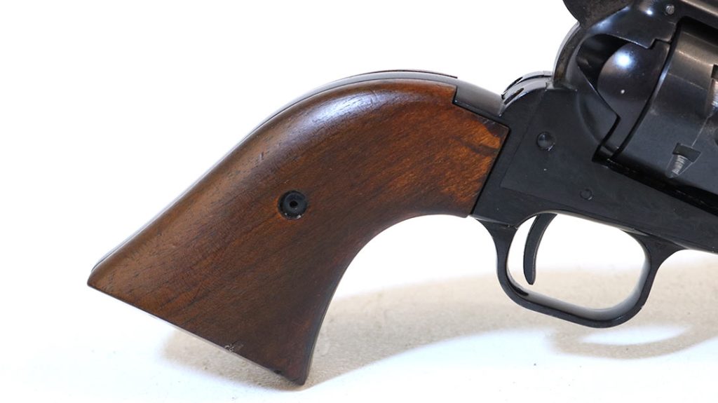 The graceful curve of the Peacemaker grip is almost sensual. Originals came with black plastic stocks. Stained walnut was available as an upgrade.