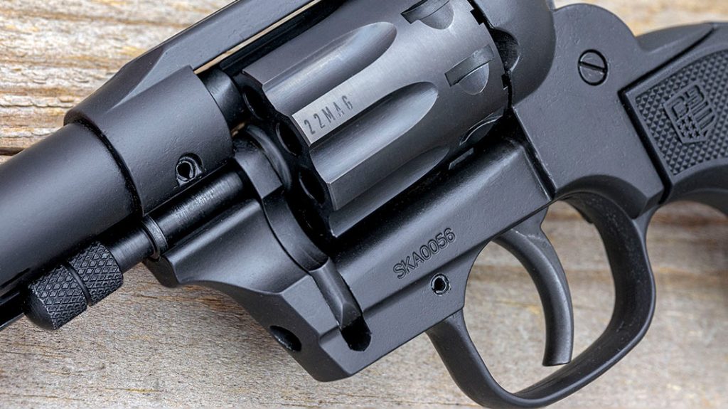 Another method of unlocking the cylinder so it can swing out is to grasp the large knurled head of the real ejector rod/cylinder pin and pull it forward.