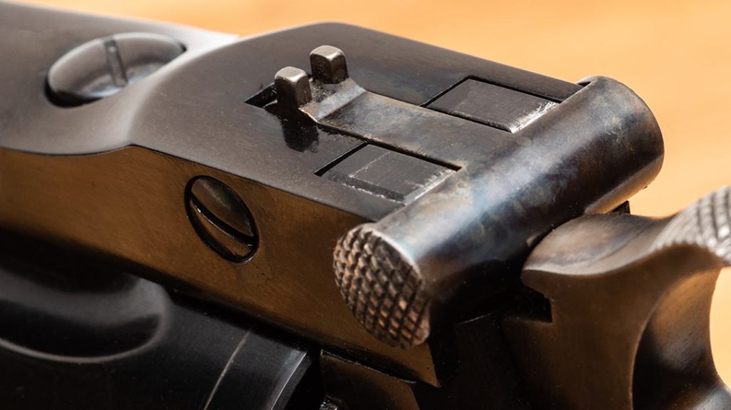 The tiny, period-correct rear sight posts offer good precision but are nearly useless for fast action.