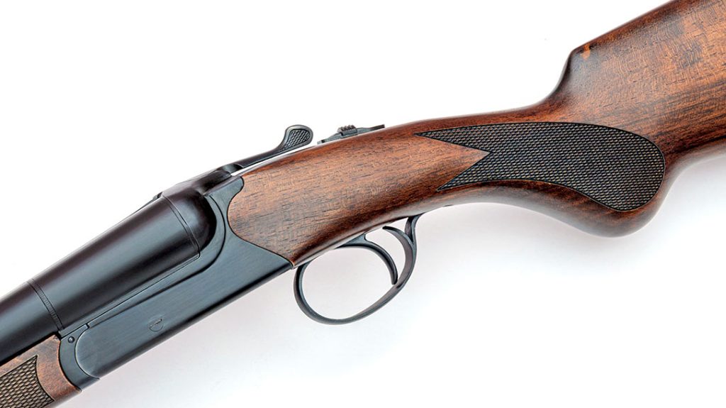 There are no external hammers on the Navy Arms Coach Gun, as it has a boxlock action with internal hammers and a single trigger to fire each barrel.