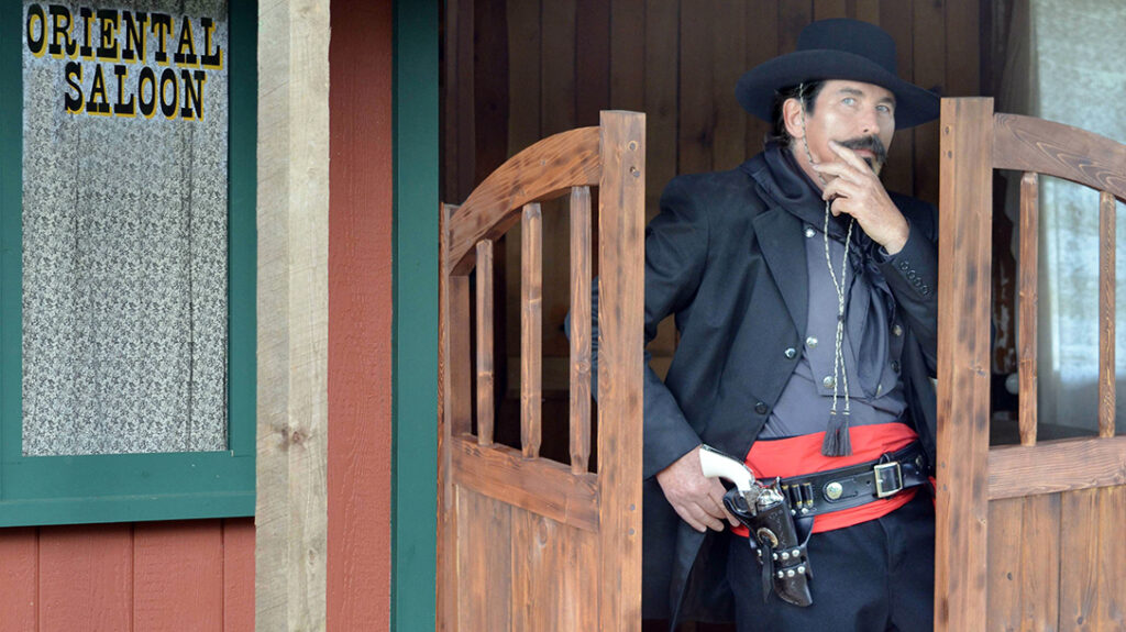 The red sash of the cowboys defines Tombstone and Johnny Ringo.