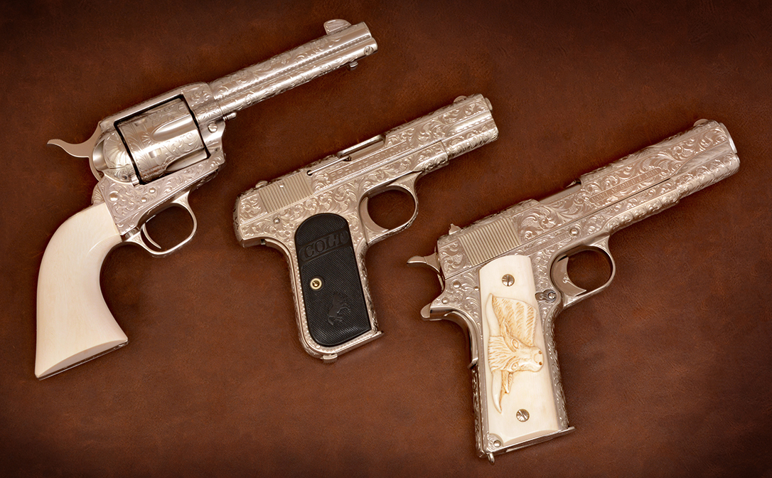 Three engraved colts show art of gunmaking.