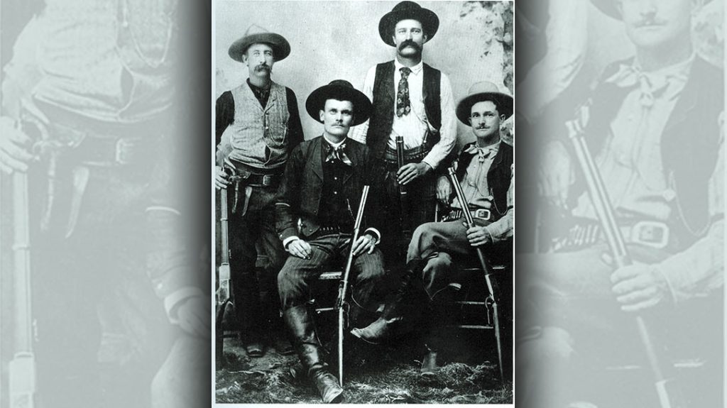 This studio-posed Texas Rangers photo is unusual in that it shows Rangers armed with large-caliber rifles (a Winchester Model 1876, two Model 1886 carbines and a short rifle). Cumbersome, heavy-caliber guns were not the norm. &ndash; A look into Texas Rangers History.